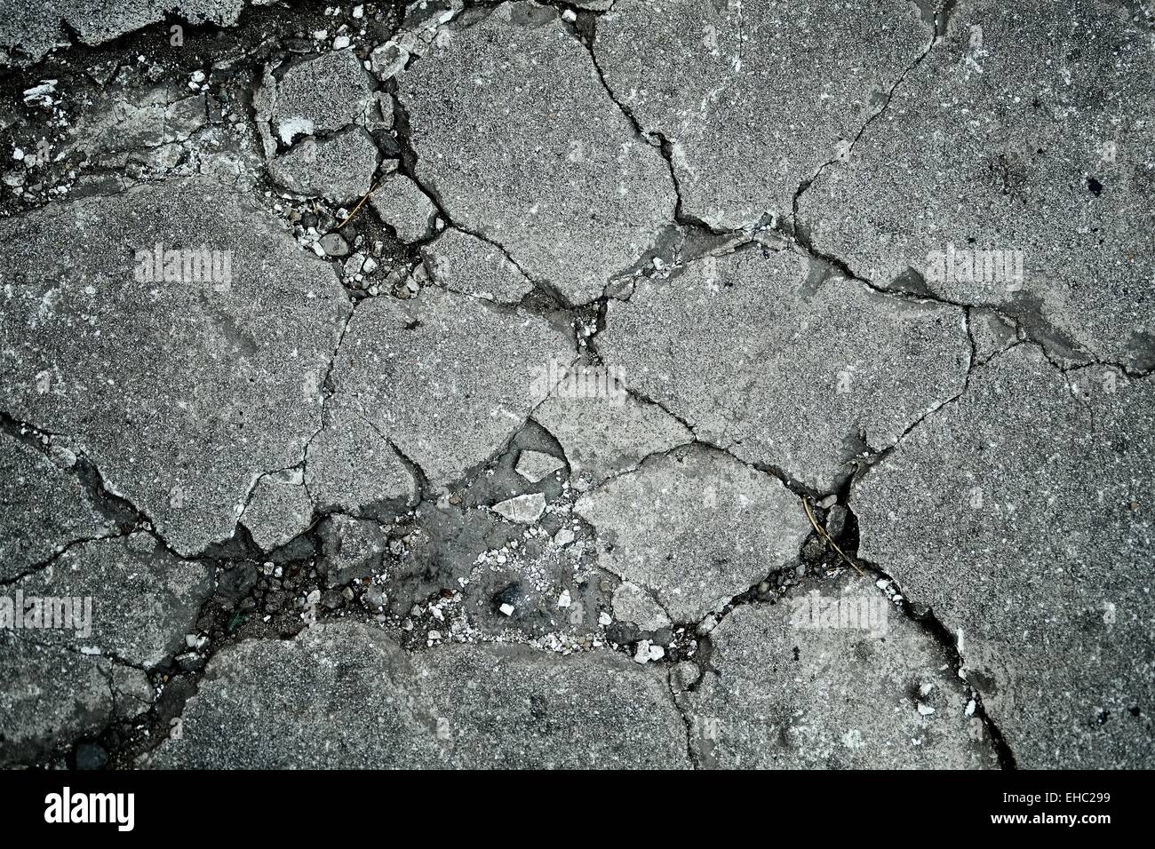 La texture du béton de ciment avec des fissures avec des fissures anciennes Banque D'Images