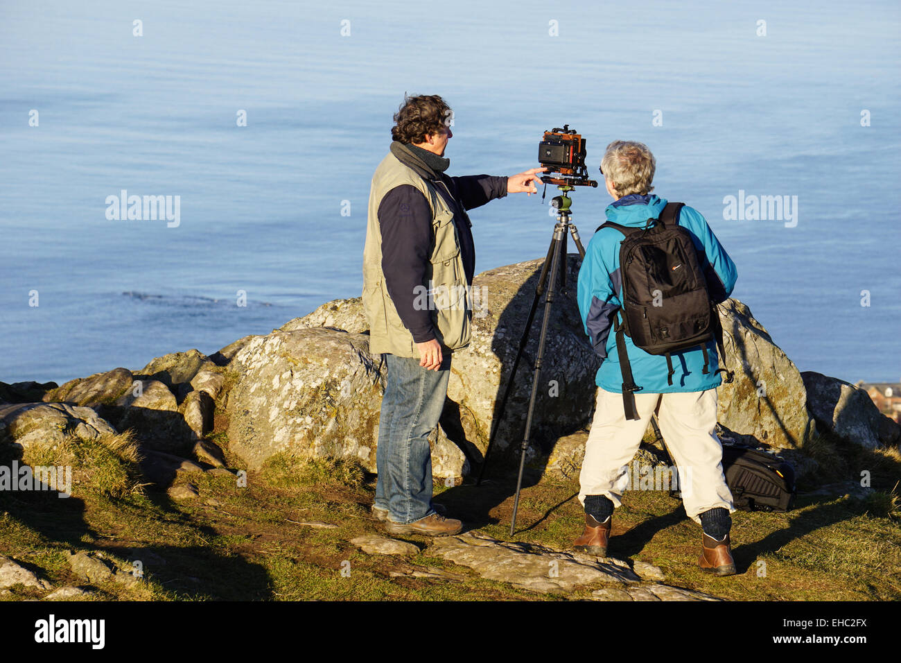 Photographe avec trépied sur Berwick Law Banque D'Images