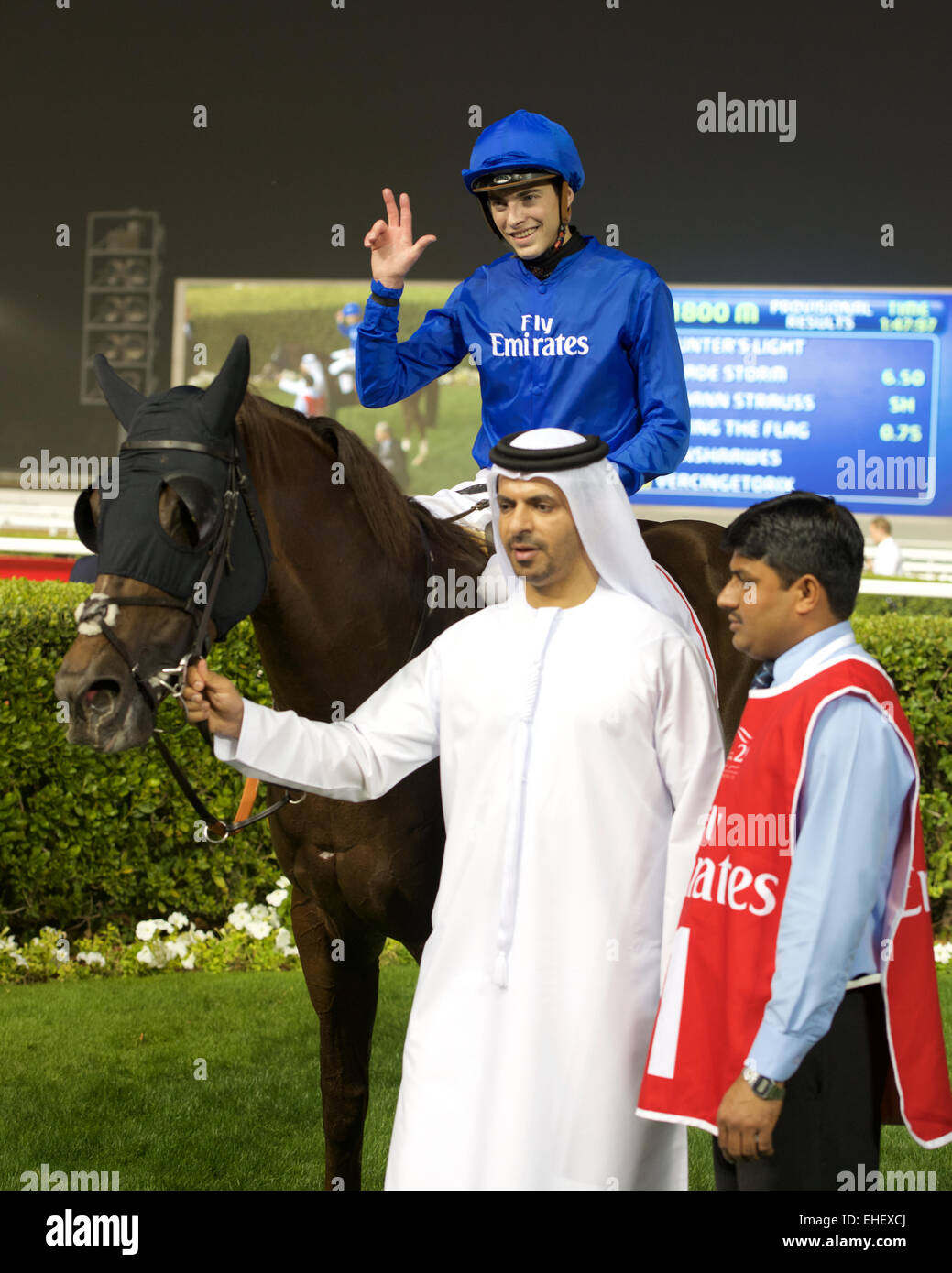 L'hippodrome de Meydan, DUBAÏ, ÉMIRATS ARABES UNIS. 7 mars, 2015. Formateur Saeed bin Suroor Godolphin jockey avec James Doyle dans le circl Banque D'Images