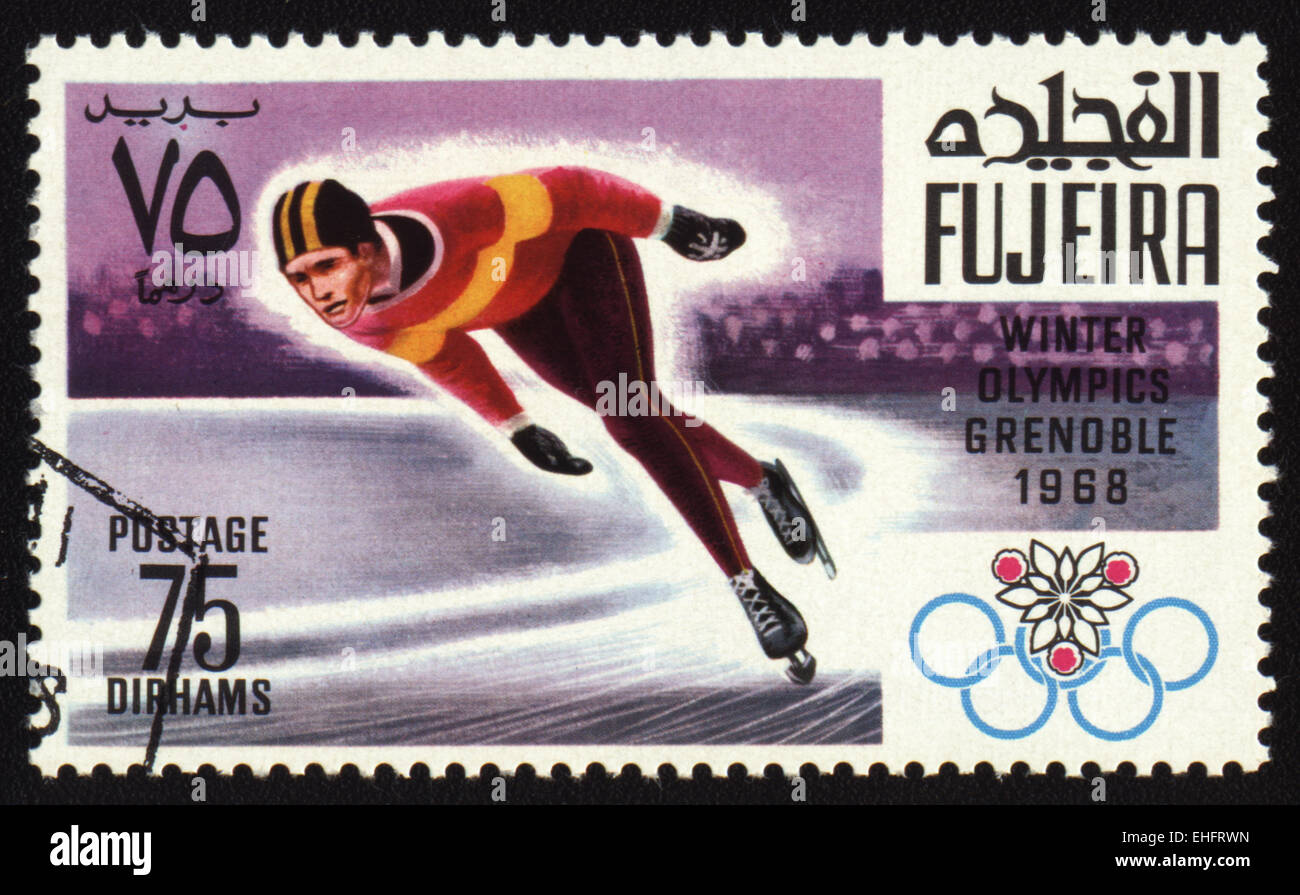 Timbre-poste de Fujeira montre Jeux Olympiques d'hiver de Grenoble 1968. Skater Banque D'Images