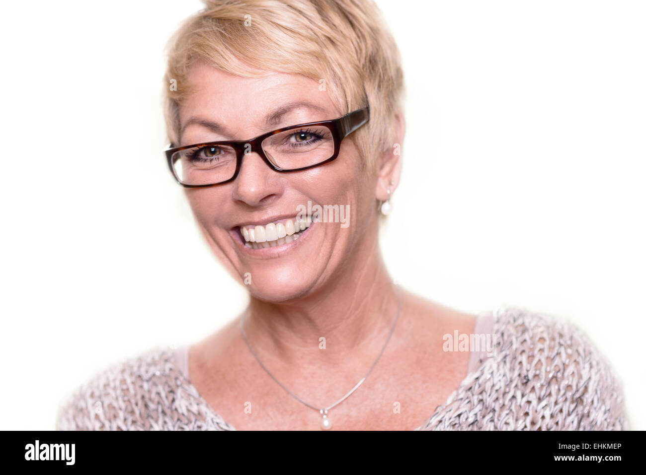 Head and shoulders portrait of a happy attractive middle-aged woman wearing glasses looking at the camera Banque D'Images