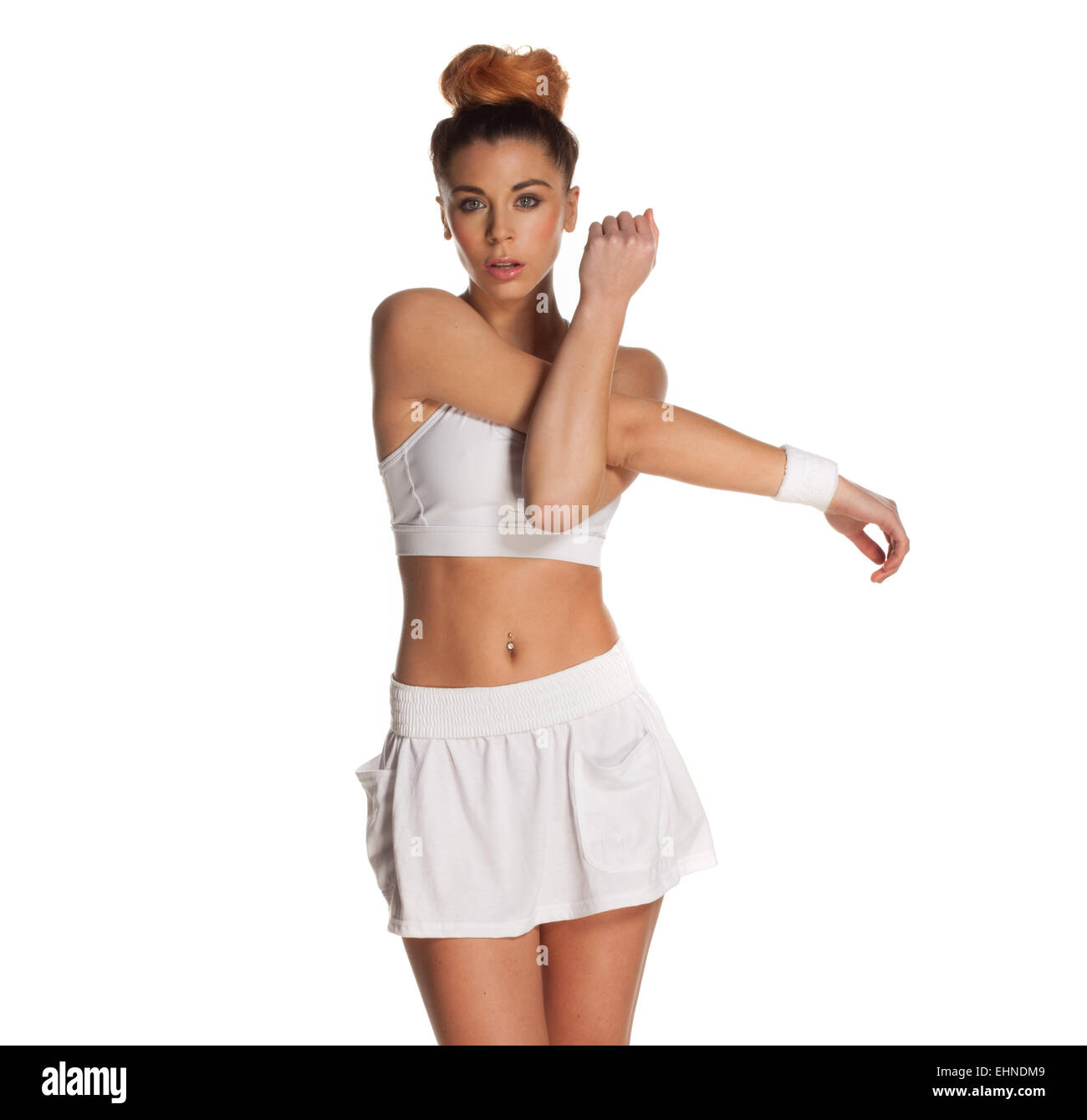 Jolie jeune femme stretching tennis player Banque D'Images