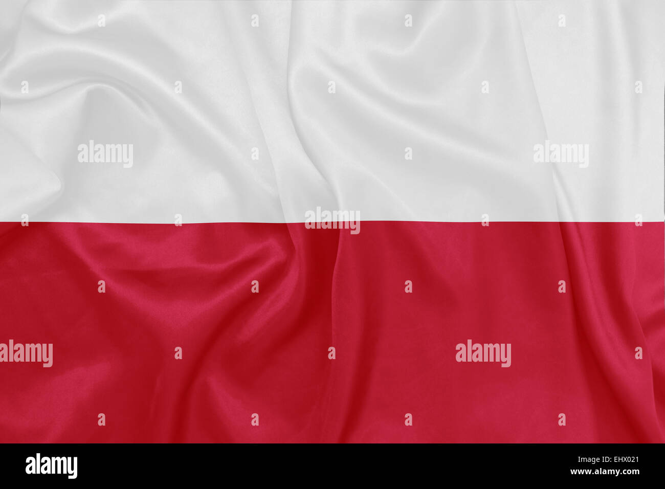 Pologne - en agitant le drapeau national sur la texture de la soie Banque D'Images