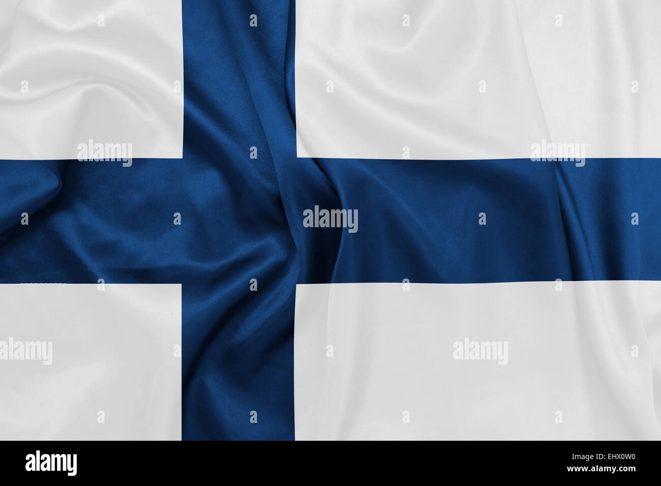 Finlande - en agitant le drapeau national sur la texture de la soie Banque D'Images