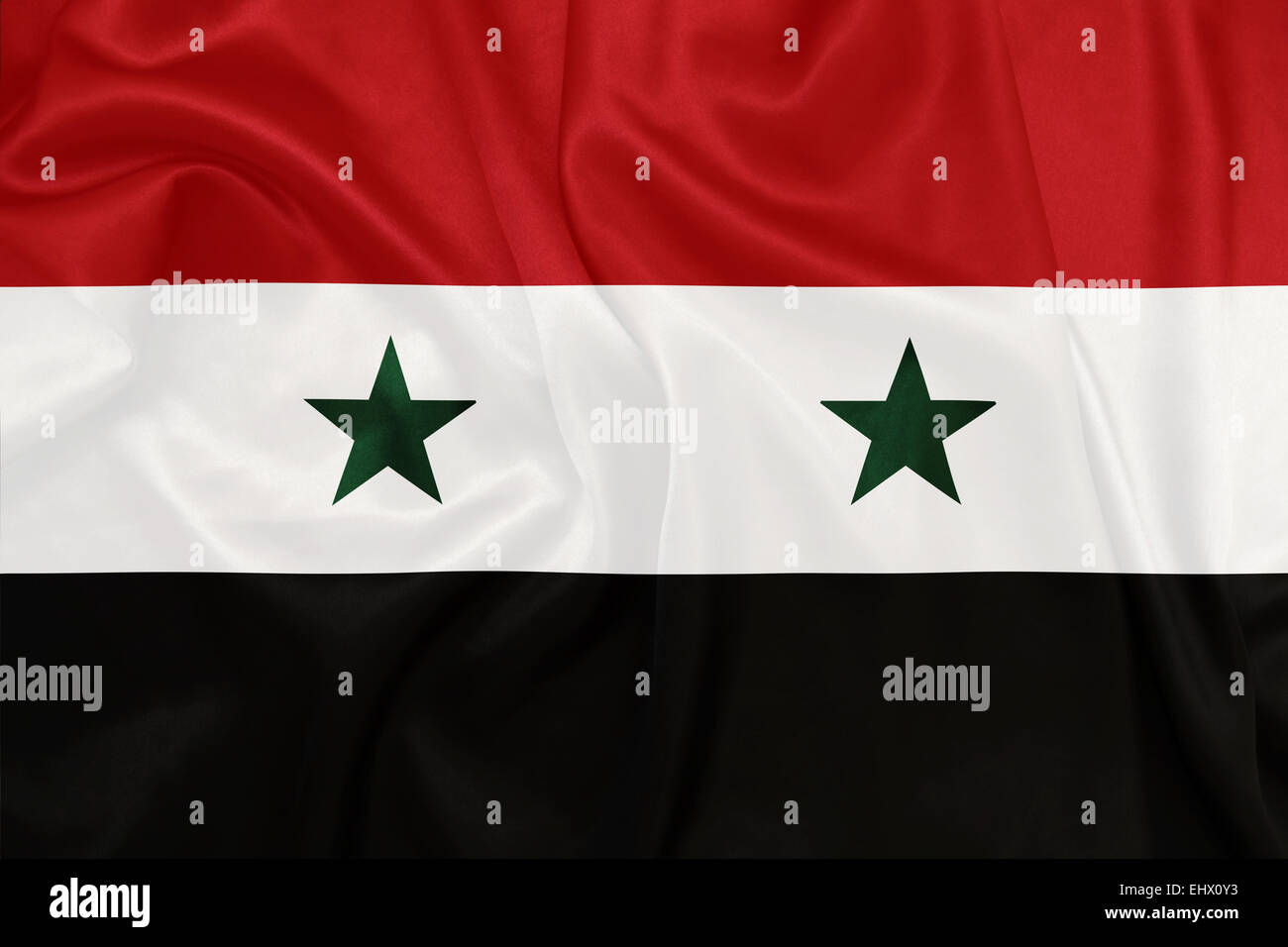 Syrie - agitant le drapeau national sur la texture de la soie Banque D'Images