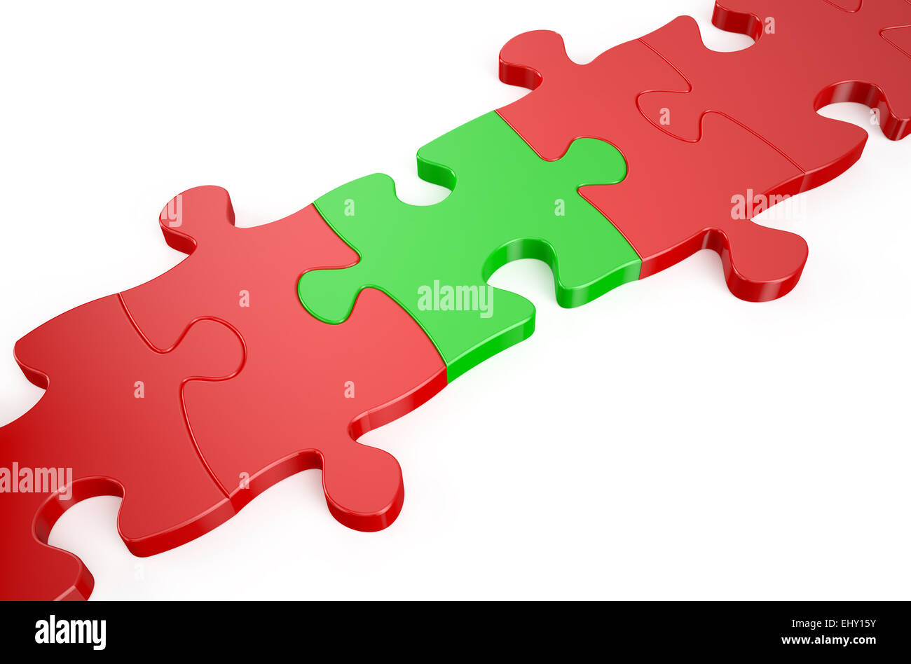 Concept leader, rouge dans le puzzle casse-tête vert Banque D'Images