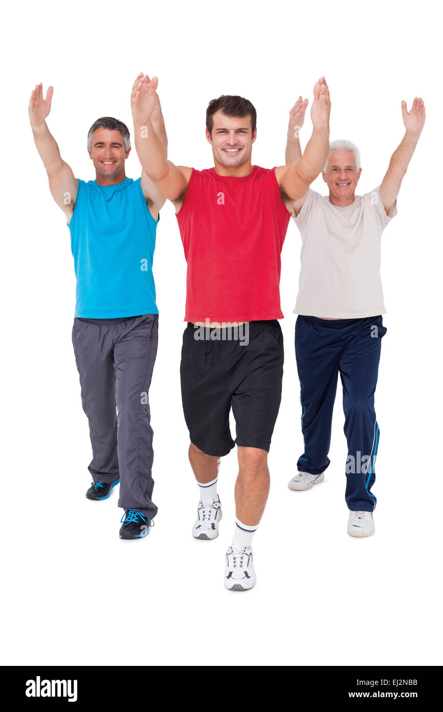 Mettre en place les hommes qui s'étend de leurs armoiries Banque D'Images