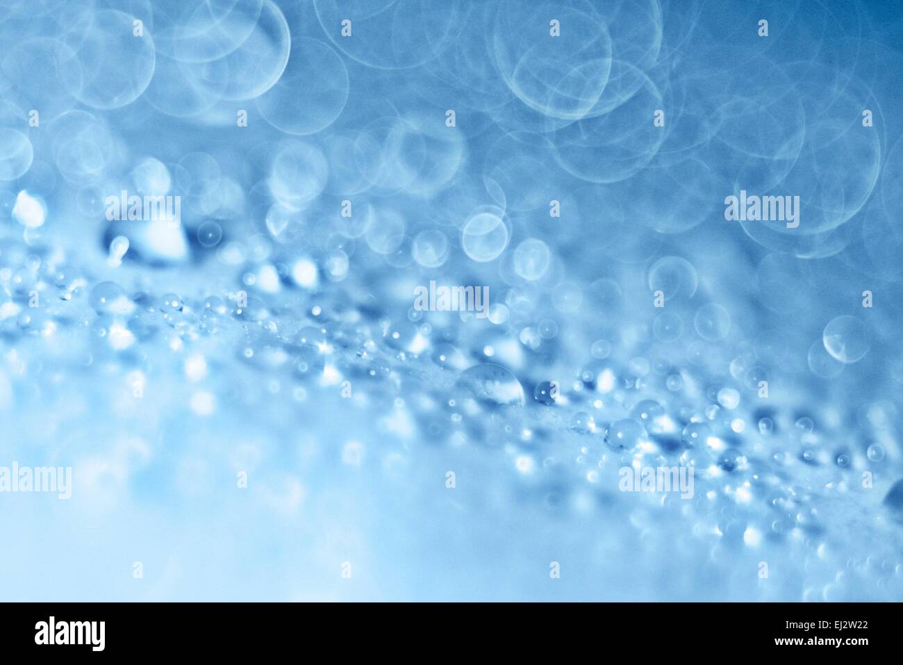 Lumière bleu fond flou flou texture gouttes Banque D'Images