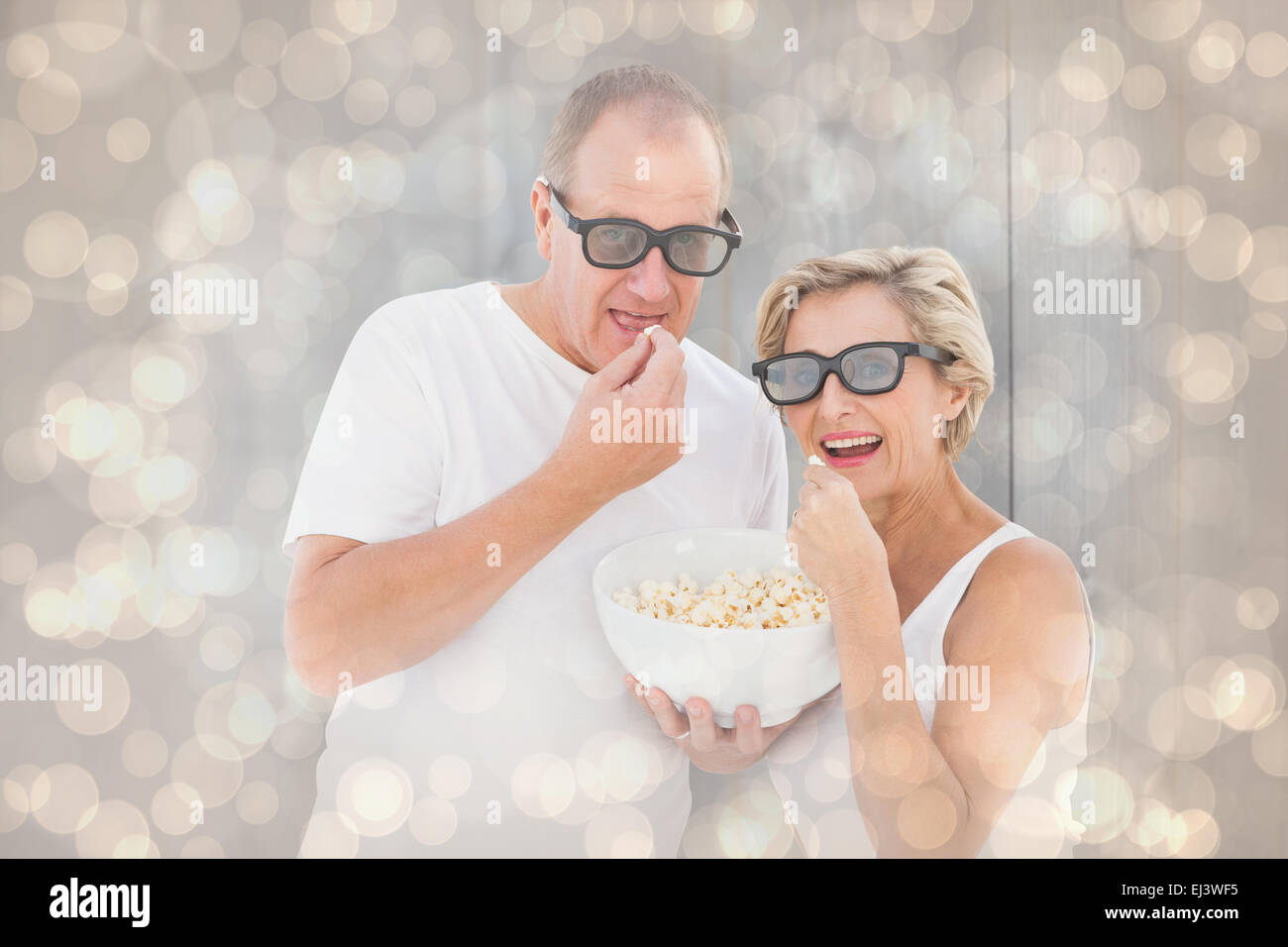 Image composite de couple 3D glasses eating popcorn Banque D'Images