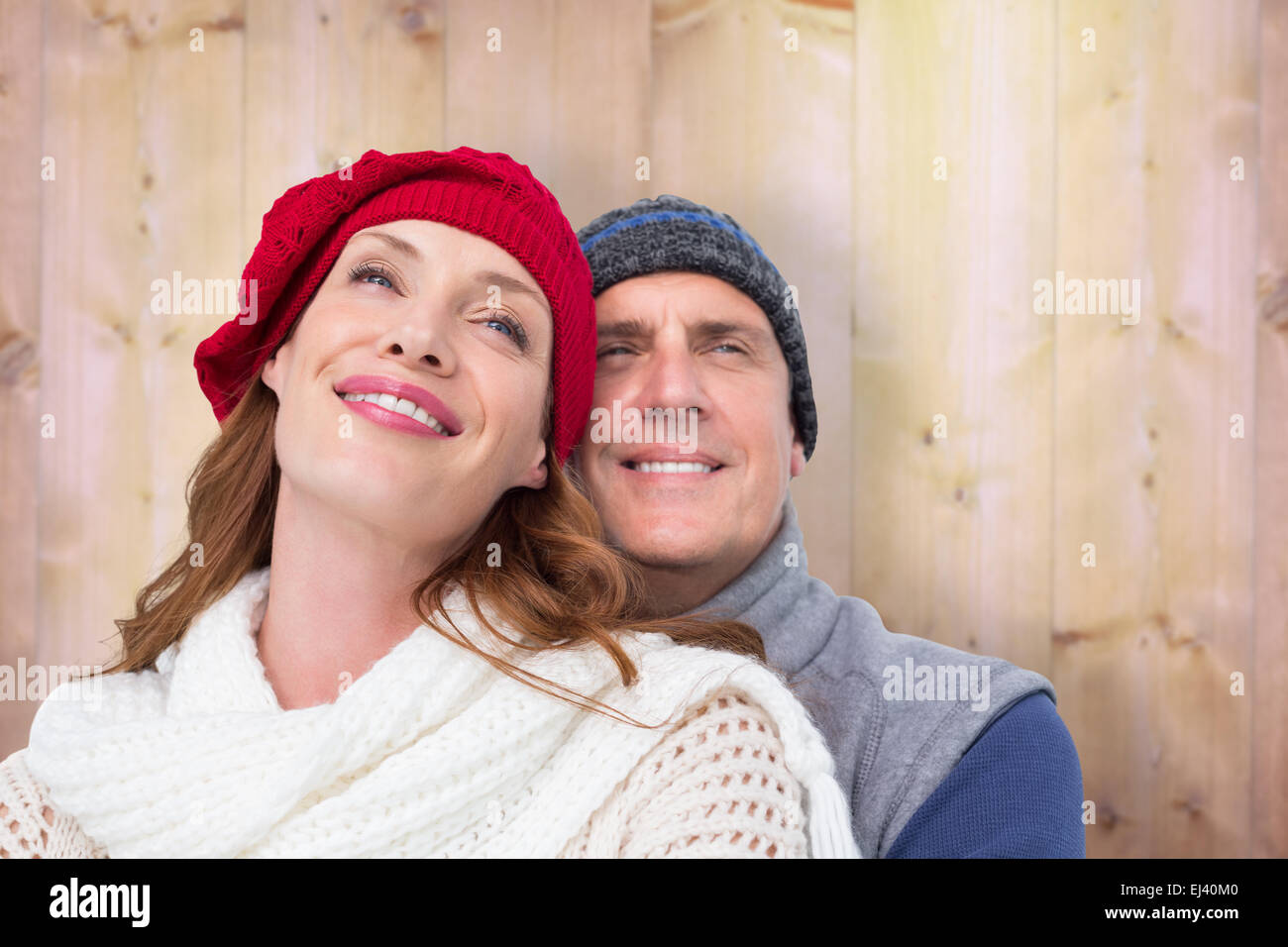 Image composite de l'heureux couple dans des vêtements chauds Banque D'Images