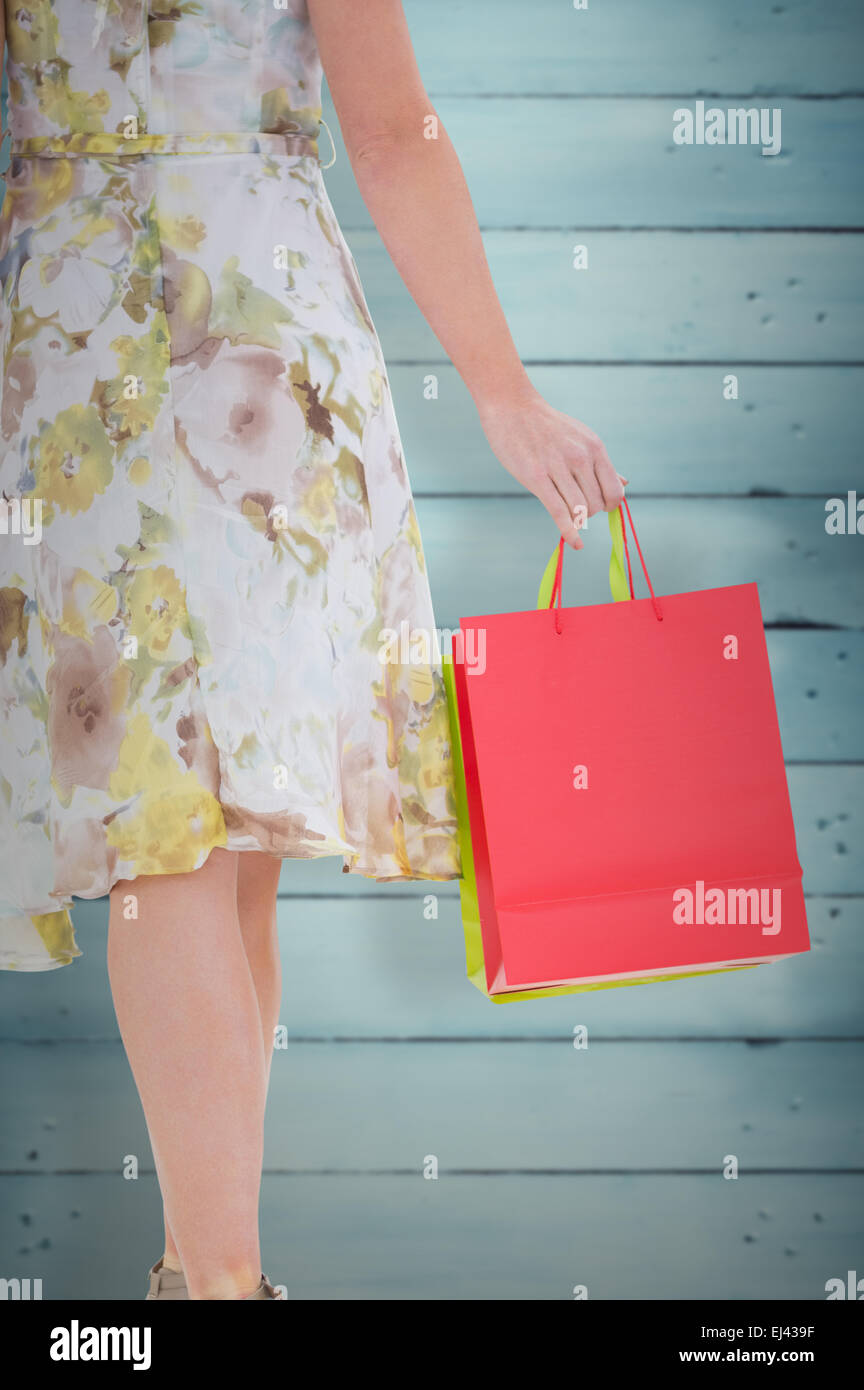 Composite image of woman with shopping bags Banque D'Images