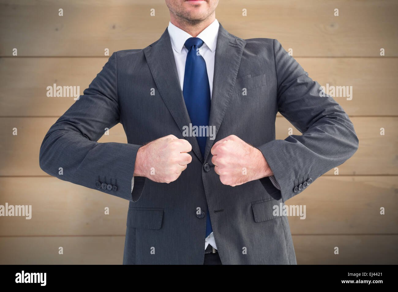 Composite image of businessman holding ses mains Banque D'Images