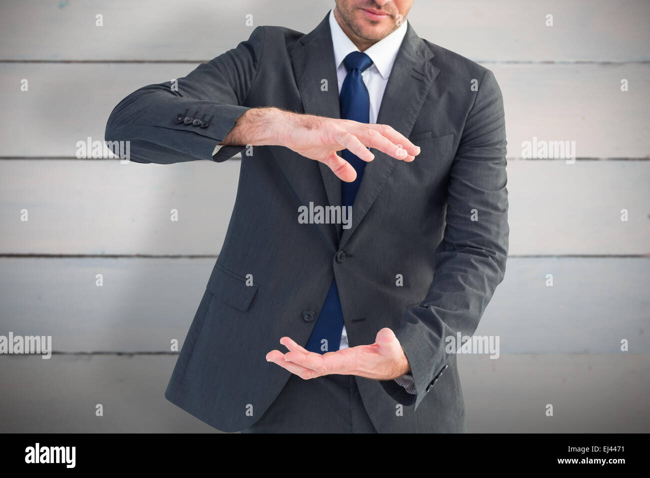 Image composite de businessman gesturing avec ses mains Banque D'Images