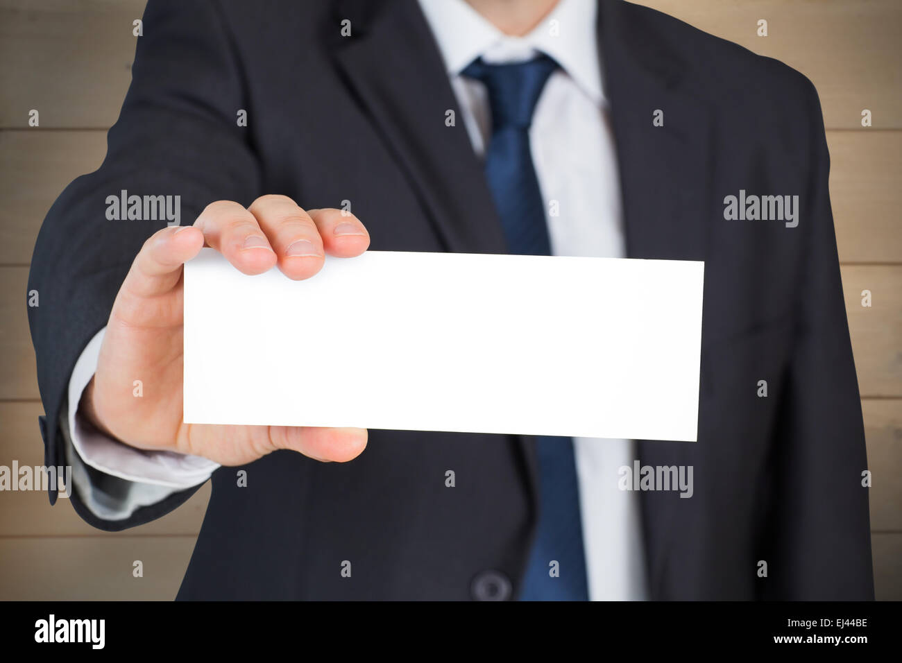 Composite image of businessman showing card Banque D'Images