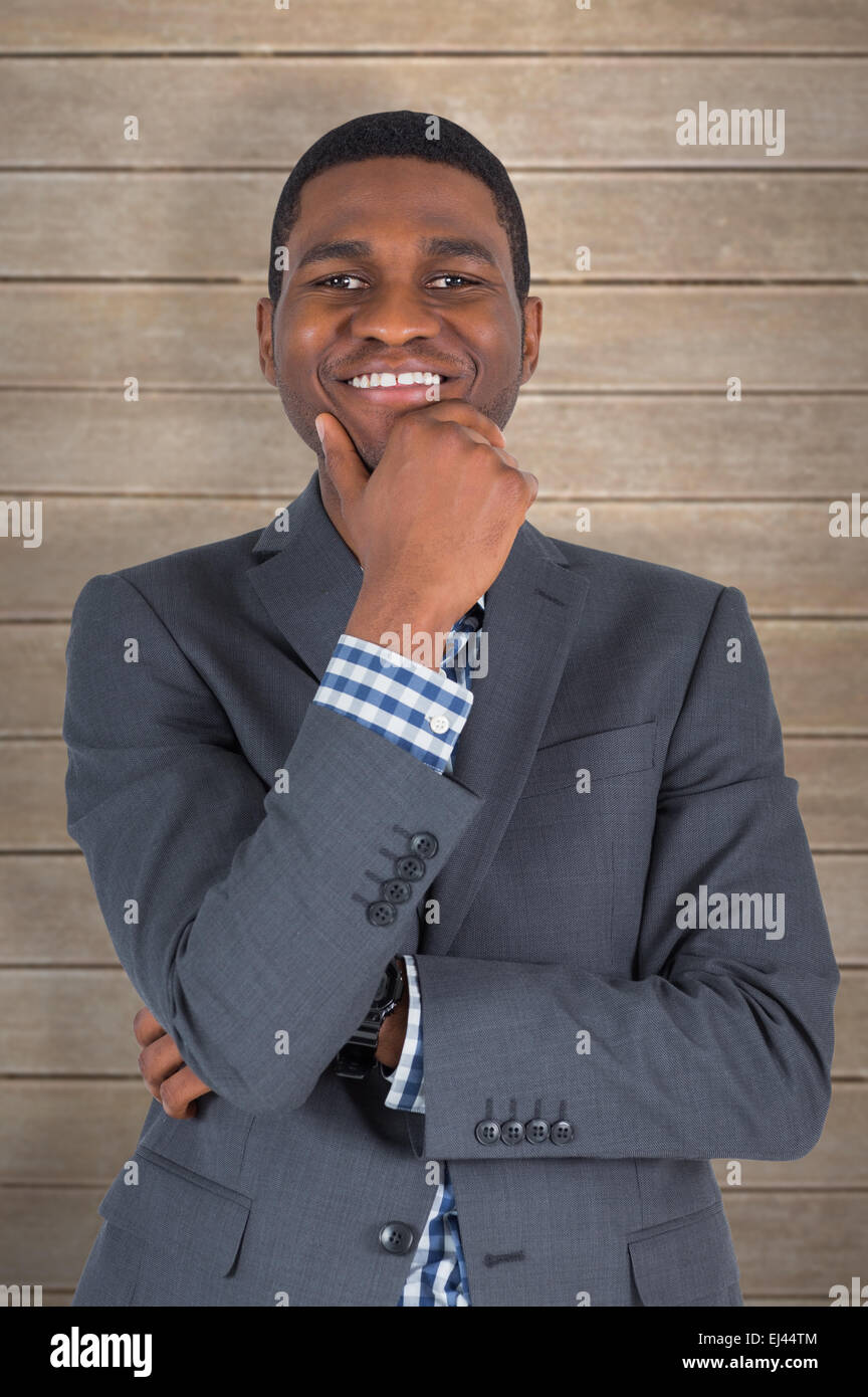 Composite image of young businessman smiling at camera Banque D'Images