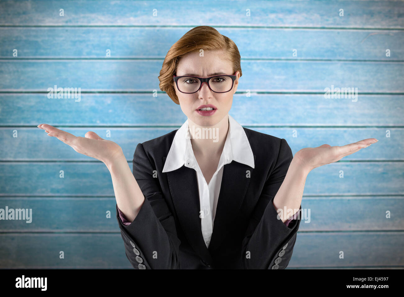 Composite image of businesswoman holding hand out dans la présentation Banque D'Images