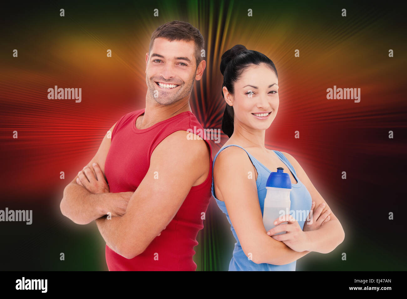 Image composite de fit man and woman smiling at camera ensemble Banque D'Images