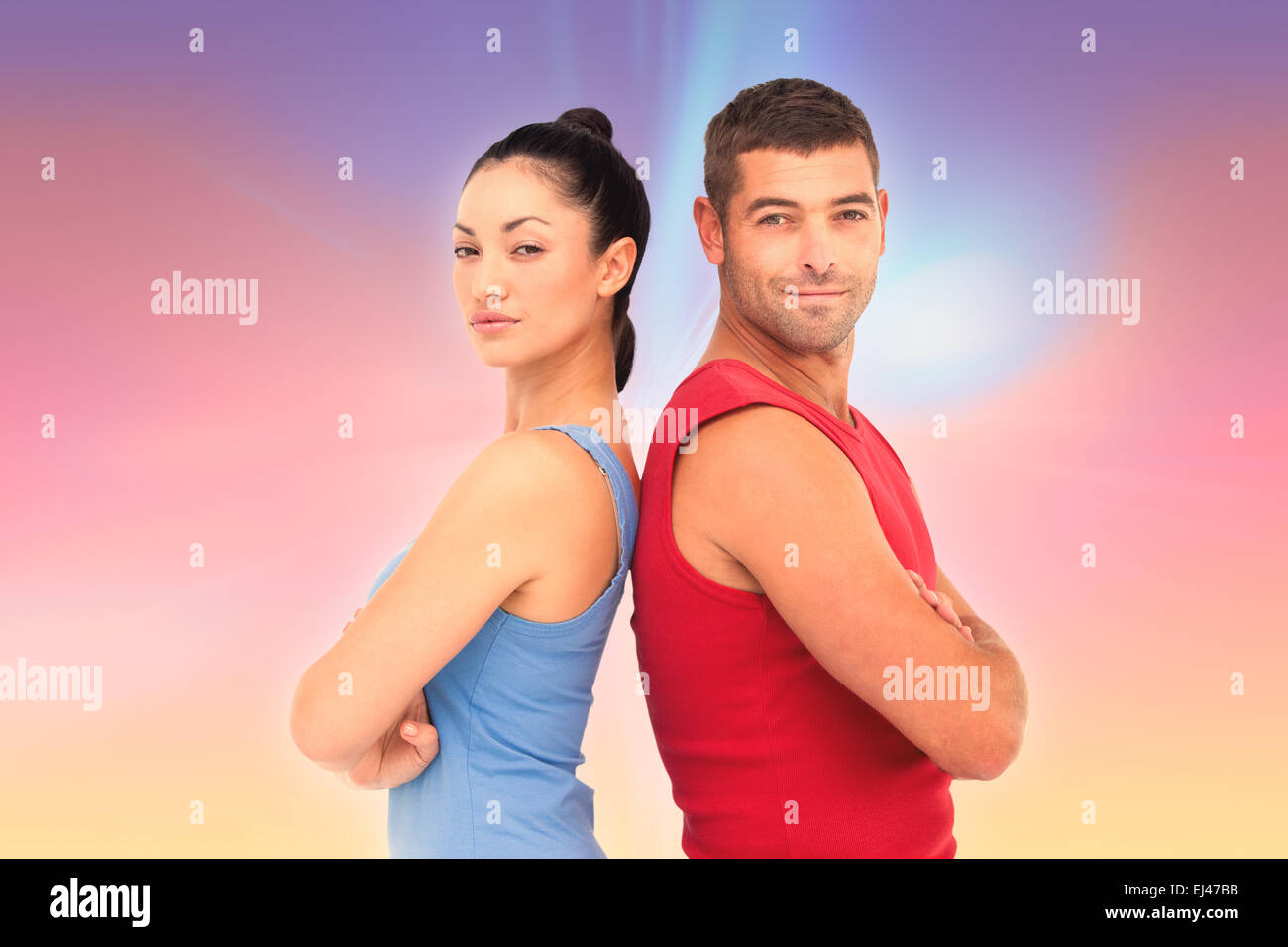 Image composite de fit man and woman smiling at camera ensemble Banque D'Images