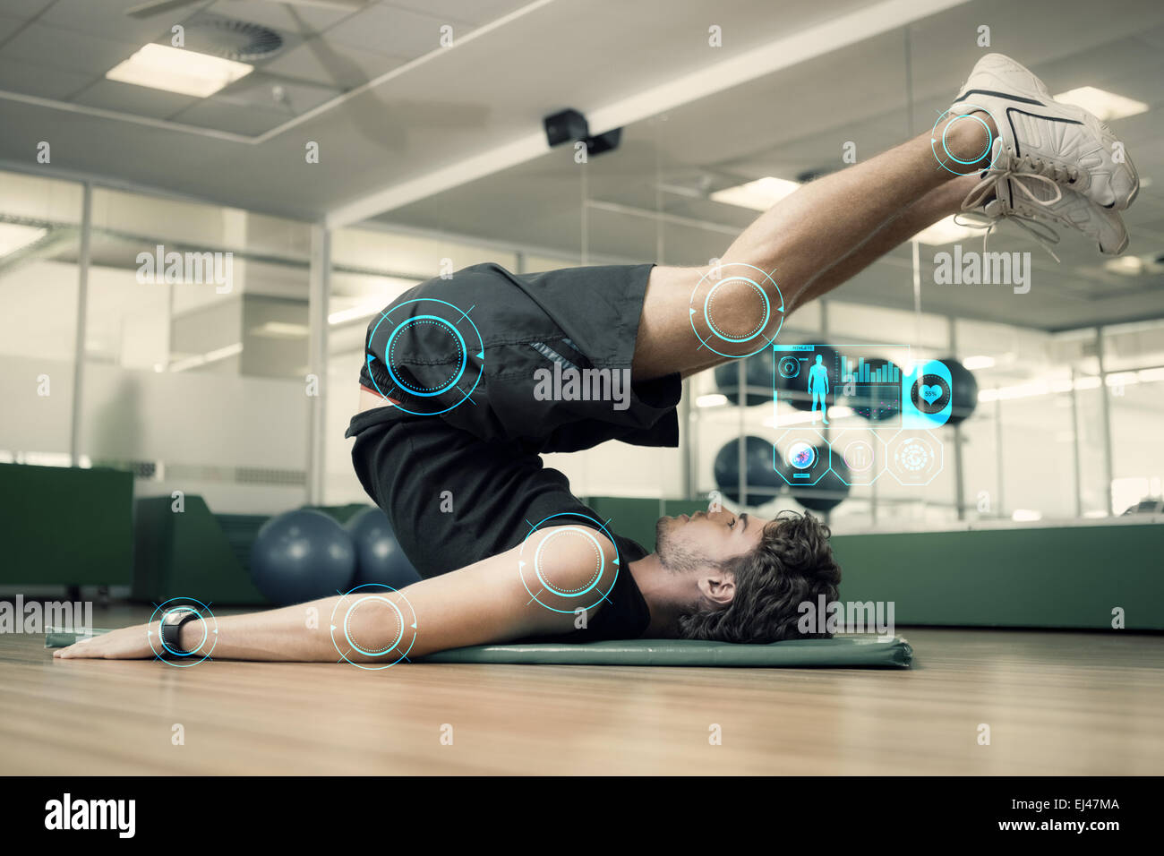 Image composite de l'homme fit faire pilates in fitness studio Banque D'Images