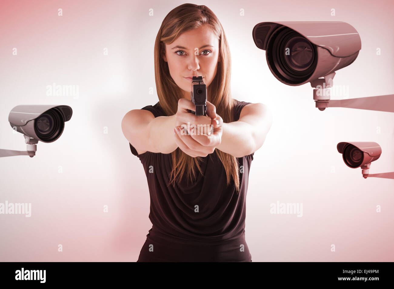 Image composite de femme fatale pointing gun at camera Banque D'Images
