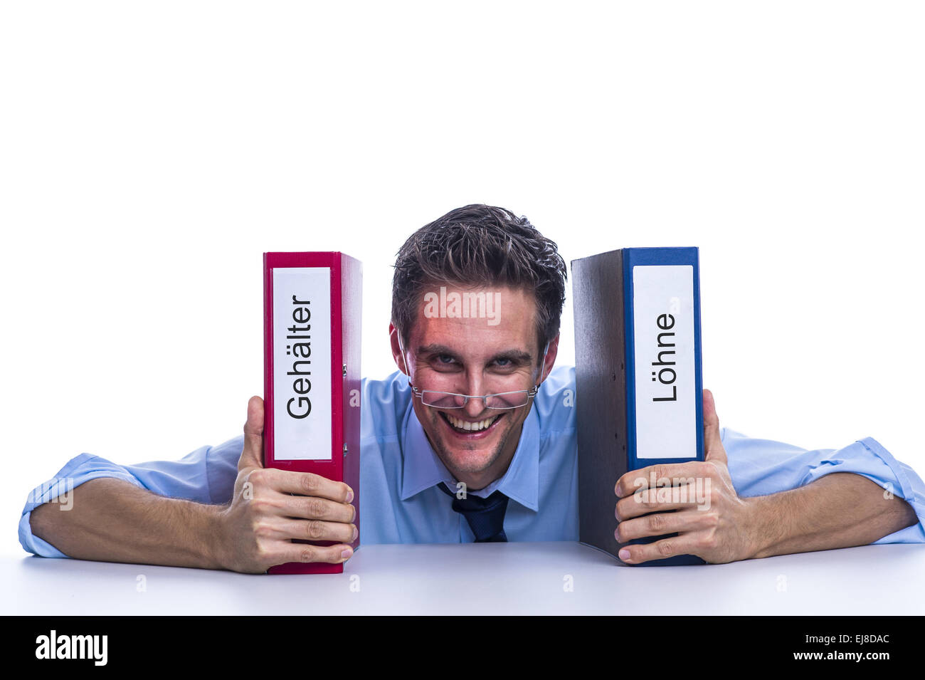 Businessman avec des dossiers de fichiers sur le bureau Banque D'Images