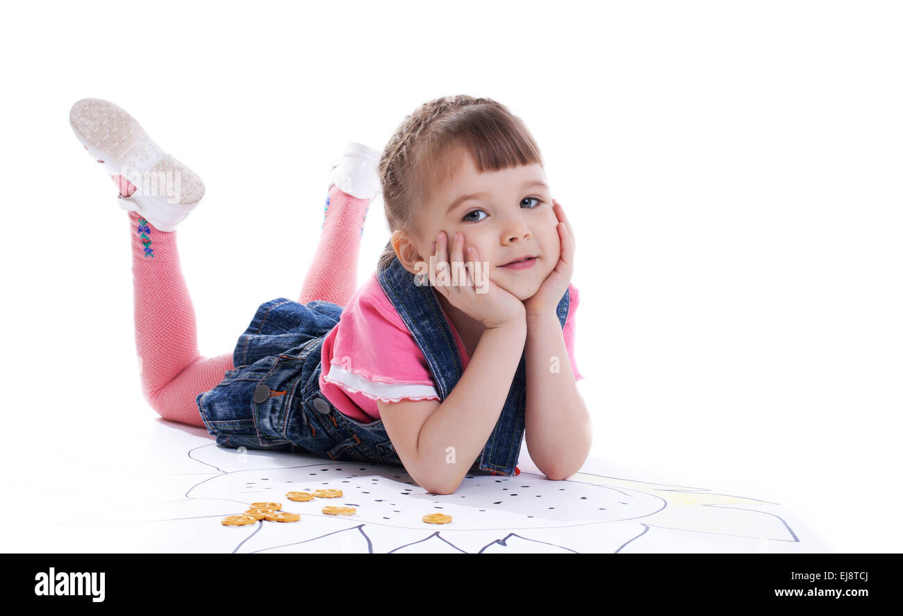 Belle petite girl lying on floor Banque D'Images