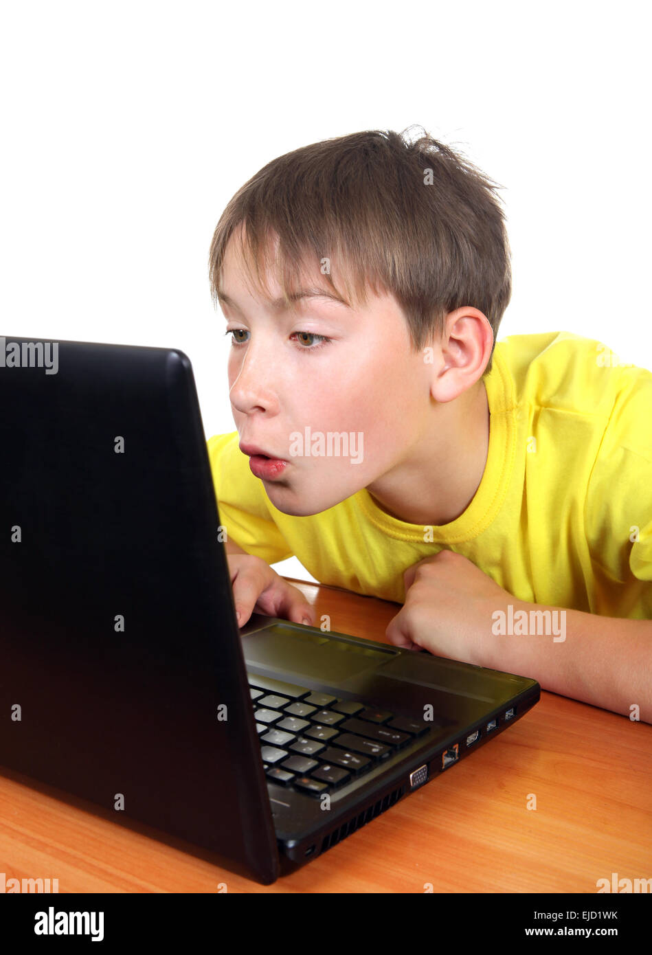 Surpris Kid with Laptop Banque D'Images