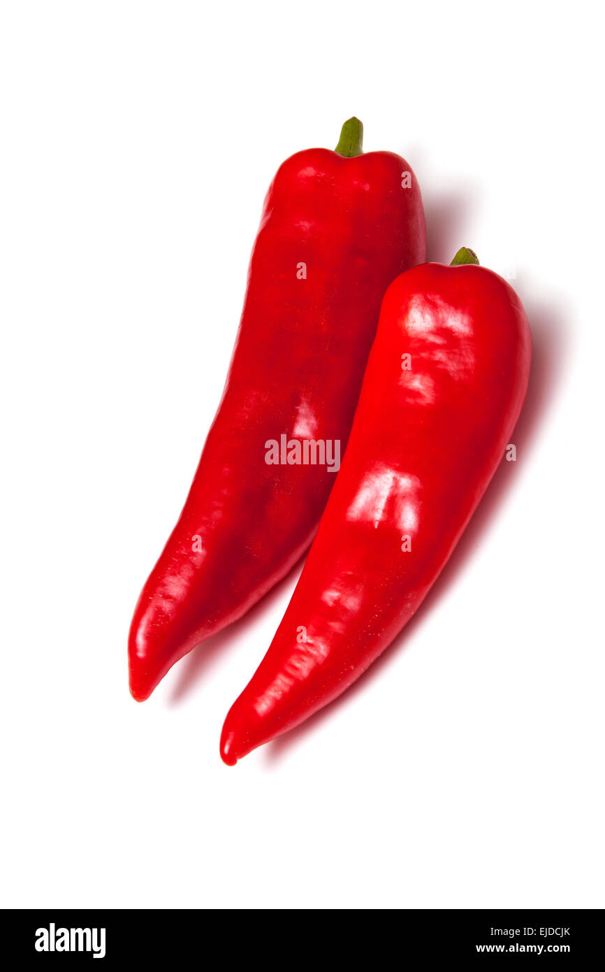 Poivrons rouges pointus isolated on a white background studio. Banque D'Images