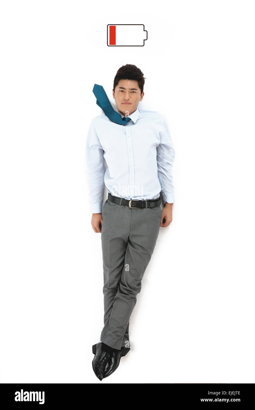 Épuisé business men lying on a white background Banque D'Images