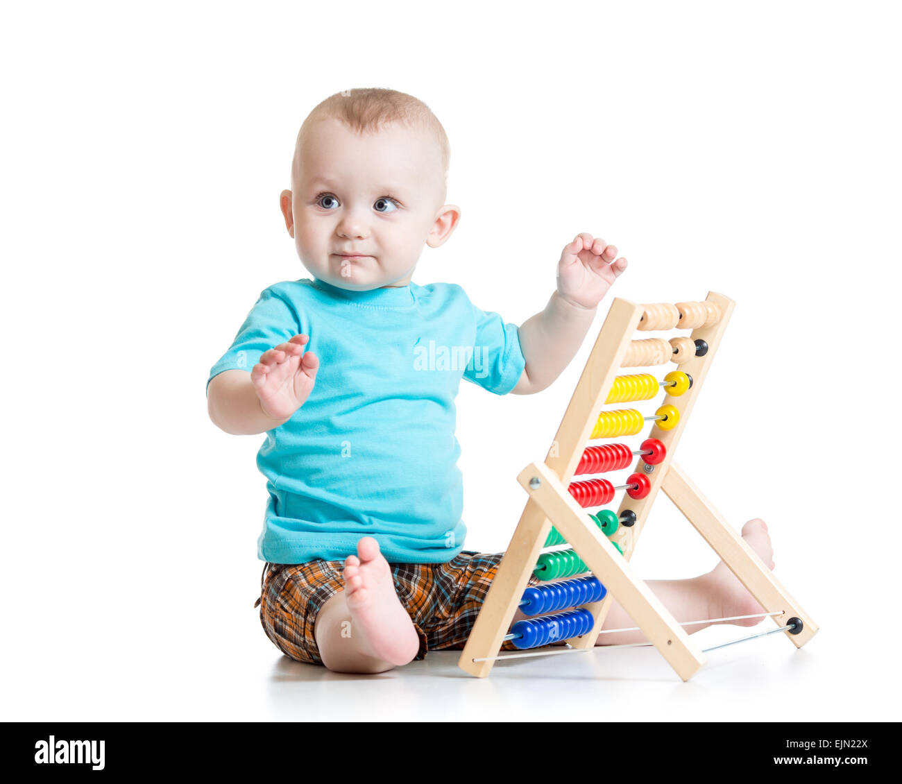 Bébé jouant avec un boulier coloré Banque D'Images