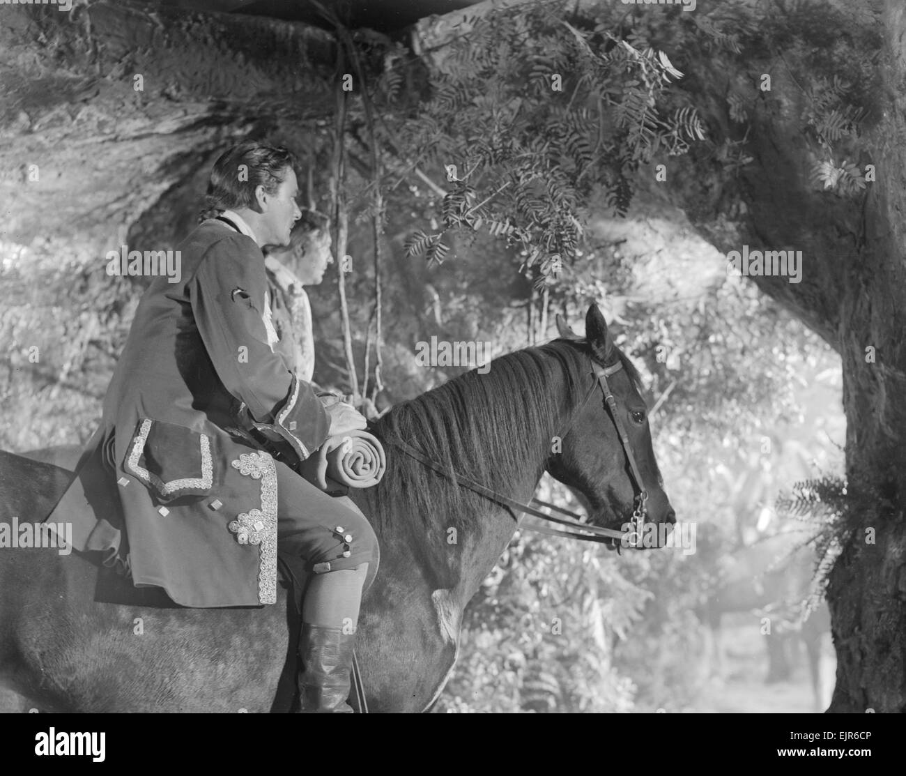 Errol Flynn comme Jamie Durie vu ici sur l'ensemble du maître de Ballantrae. 6 octobre 1952 Banque D'Images