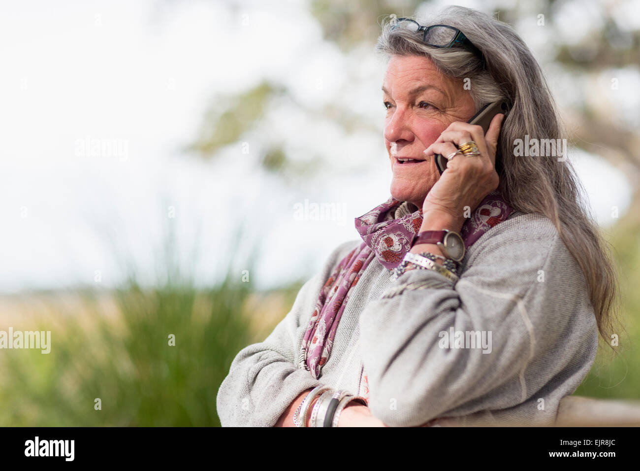 Older Caucasian Woman talking on cell phone Banque D'Images
