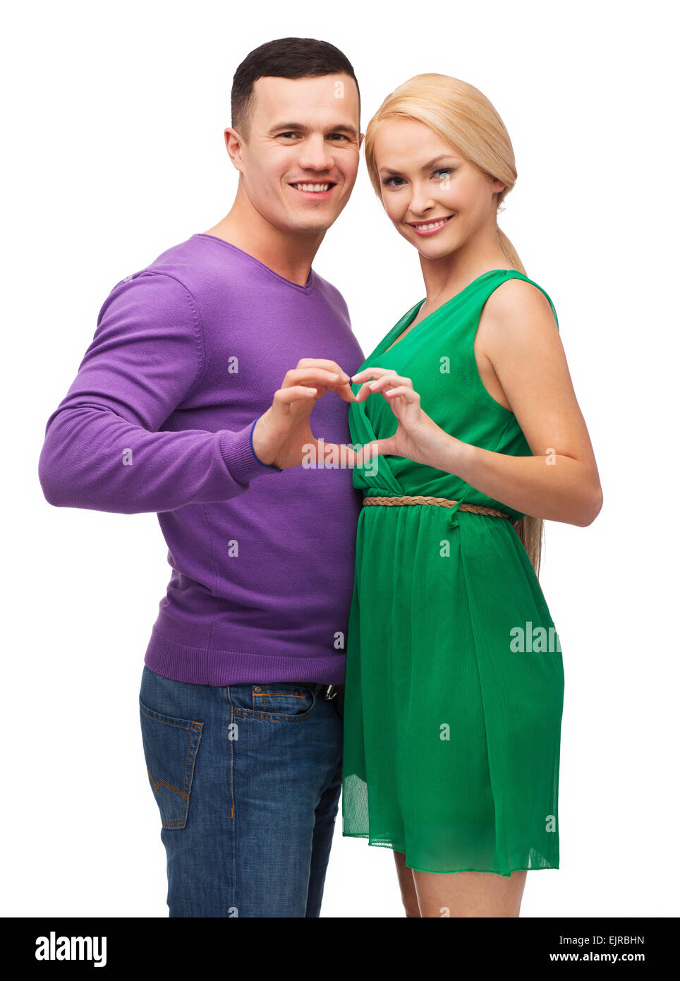 Smiling couple montrant coeur avec les mains Banque D'Images