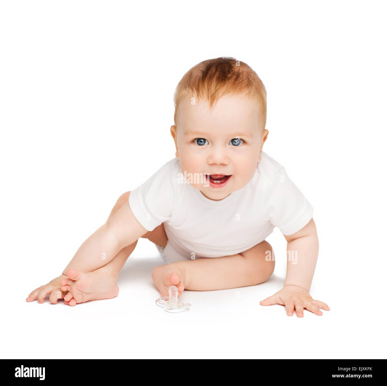 Smiling baby sitting on the floor Banque D'Images