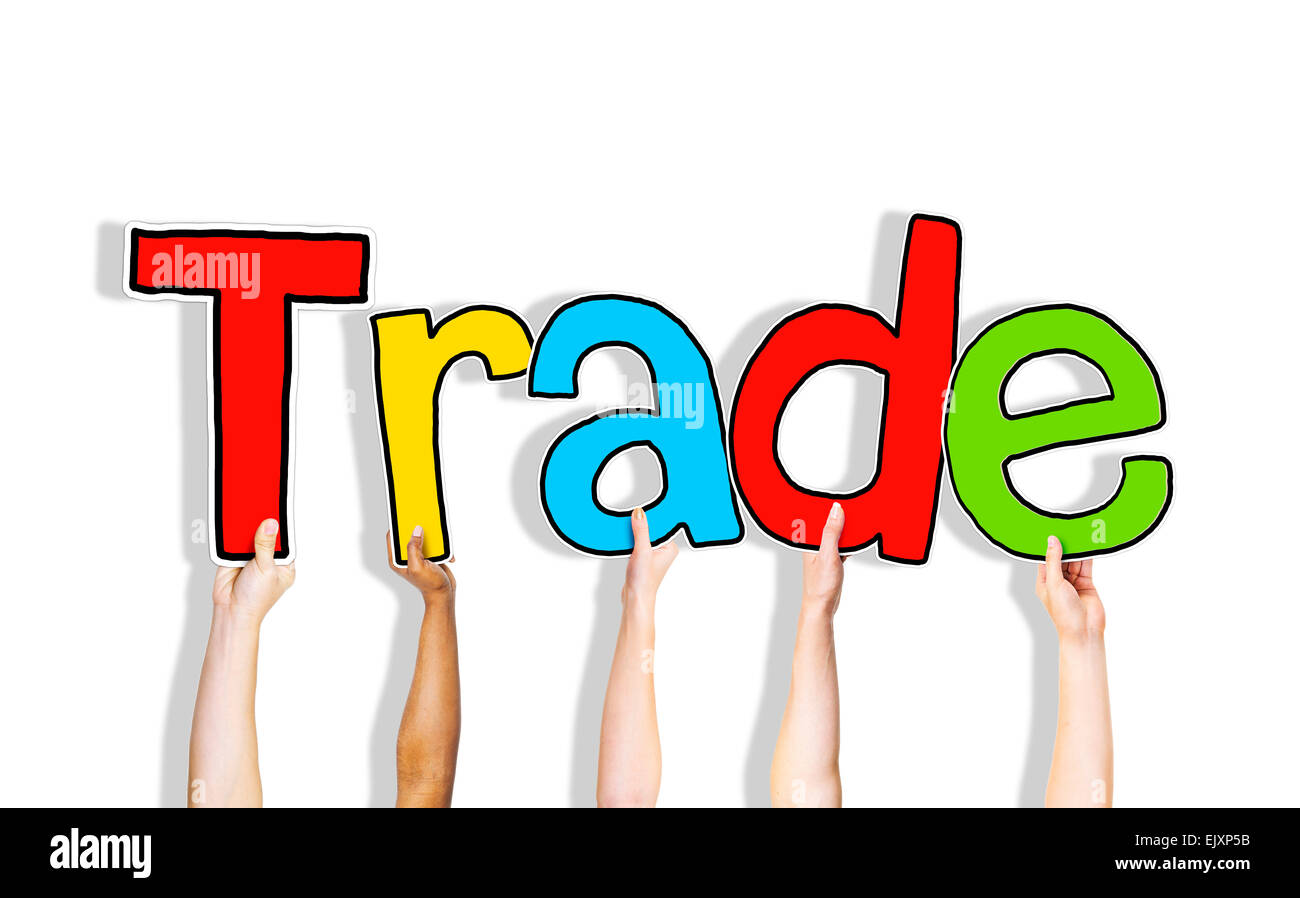 Diverses mains tenant le mot Trade Banque D'Images