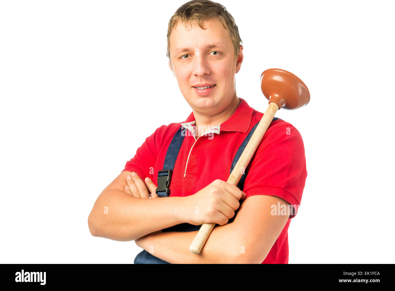 Travailleur homme en salopette avec un piston Banque D'Images