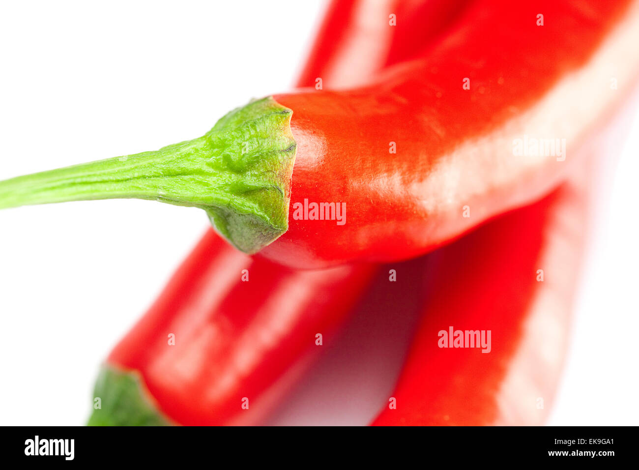 Juicy red chili peppers isolated on white Banque D'Images