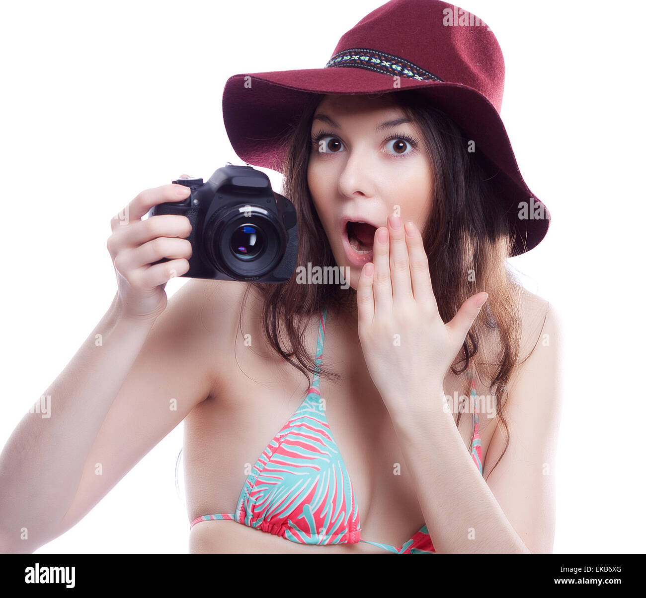 Femme souriante avec appareil photo professionnel Banque D'Images