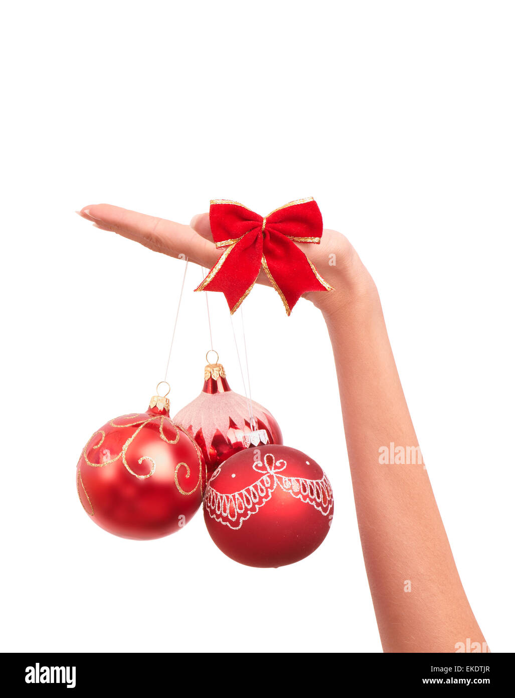 Trois boules de l'arbre de Noël dans la main Banque D'Images