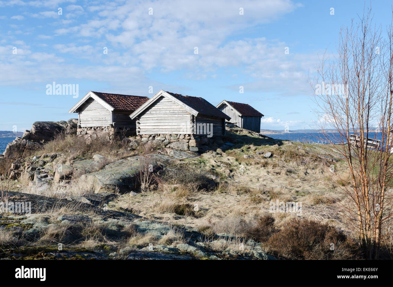 Trois anciens Boat House sur la côte en Suède Banque D'Images