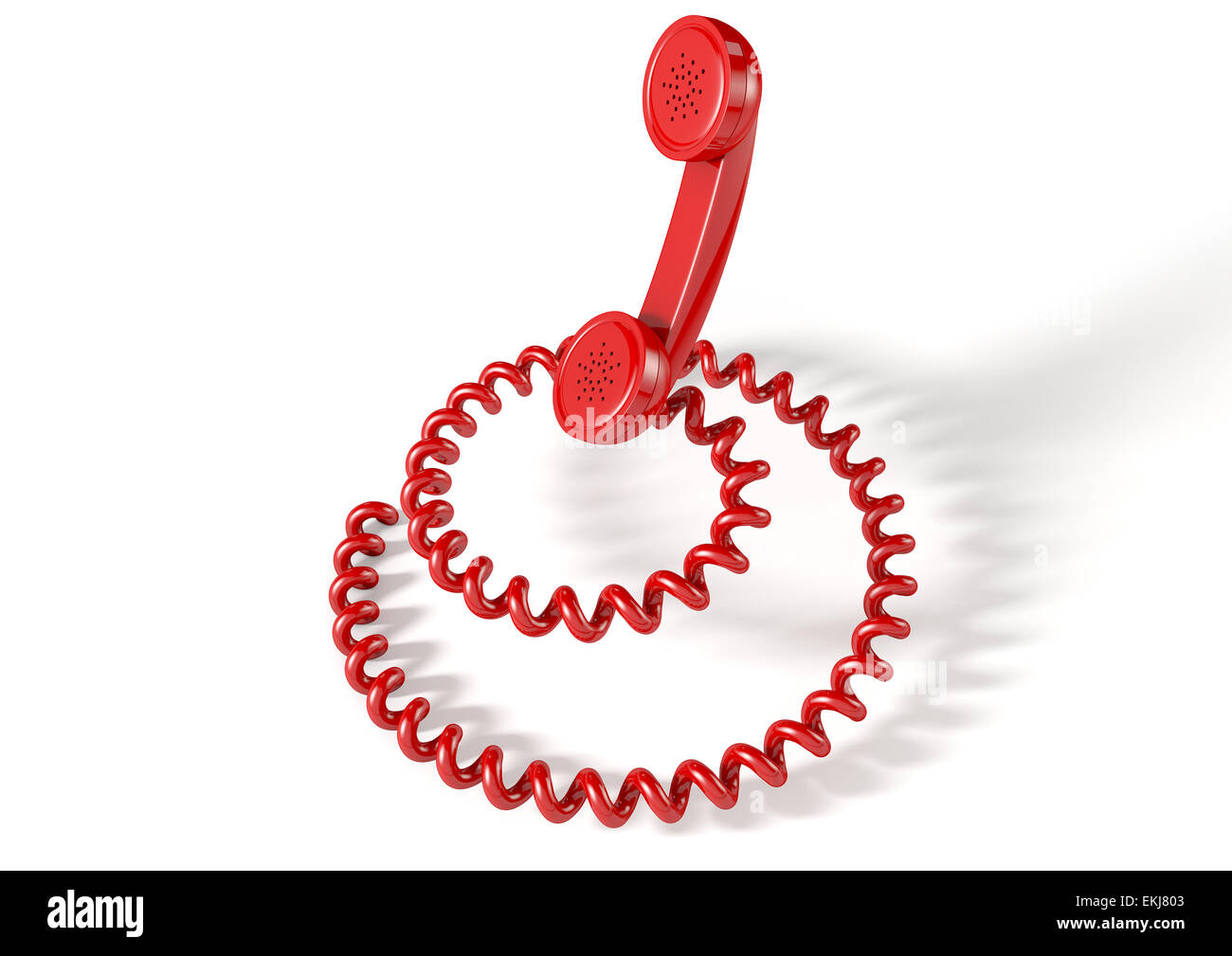 Un combiné téléphonique vintage connecté à un cordon enroulé en forme de spirale sur un fond studio blanc isolé Banque D'Images