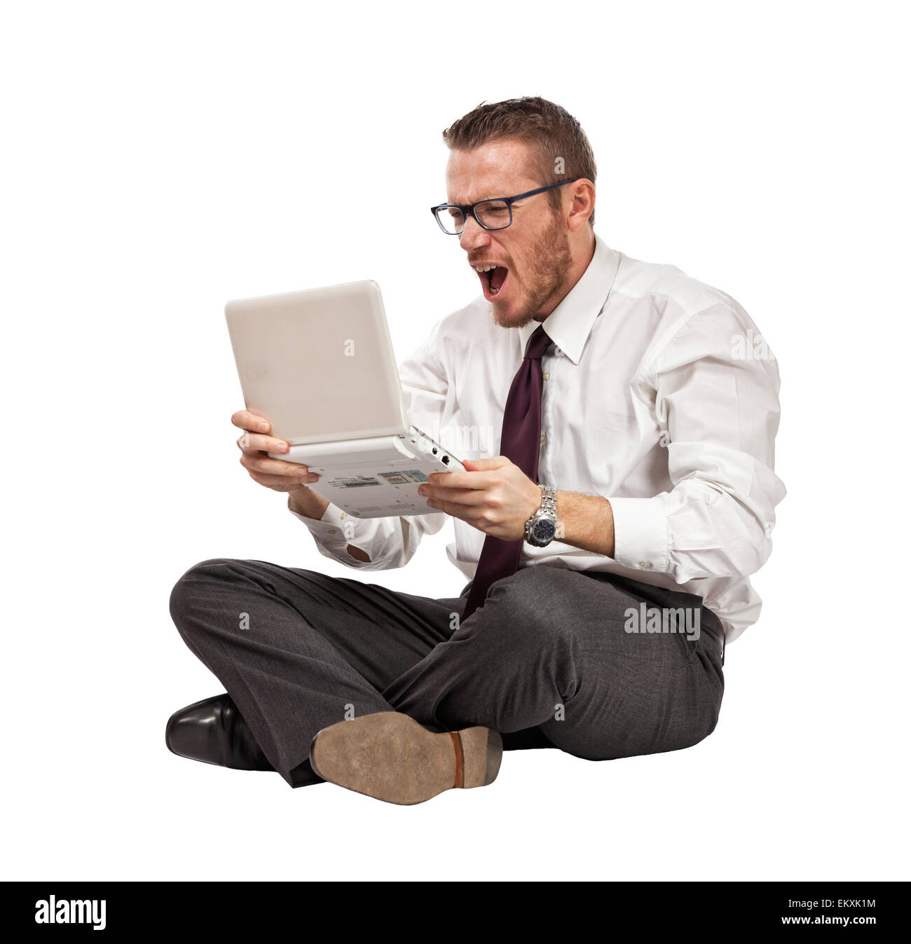 Angry businessman with notebook isolated on white Banque D'Images