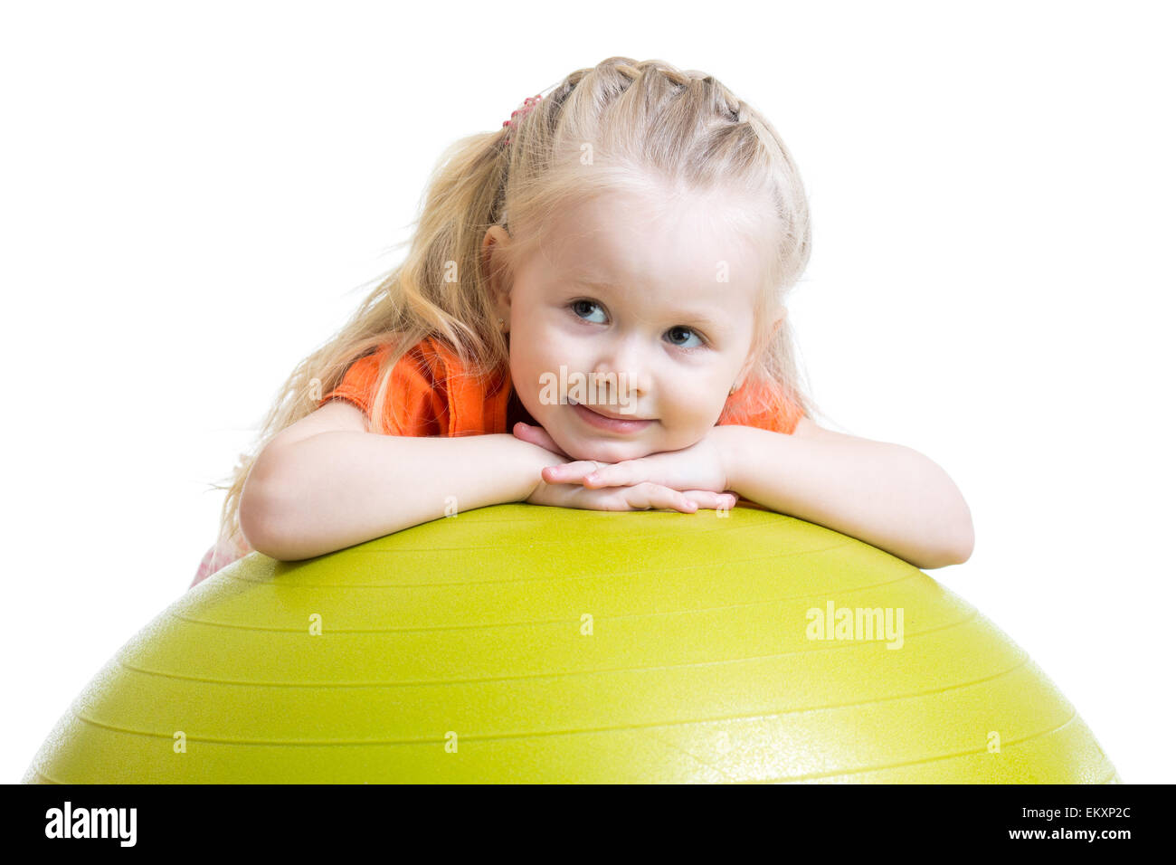 Enfant girl doing fitness exercise with ball Banque D'Images