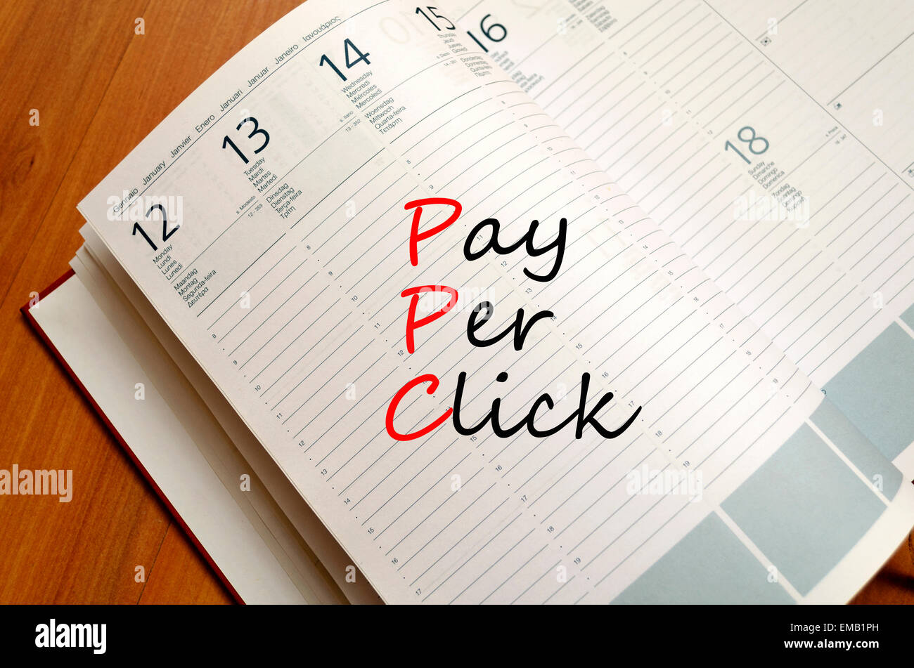 Payer par Cliquez sur le bloc-notes de concept Banque D'Images