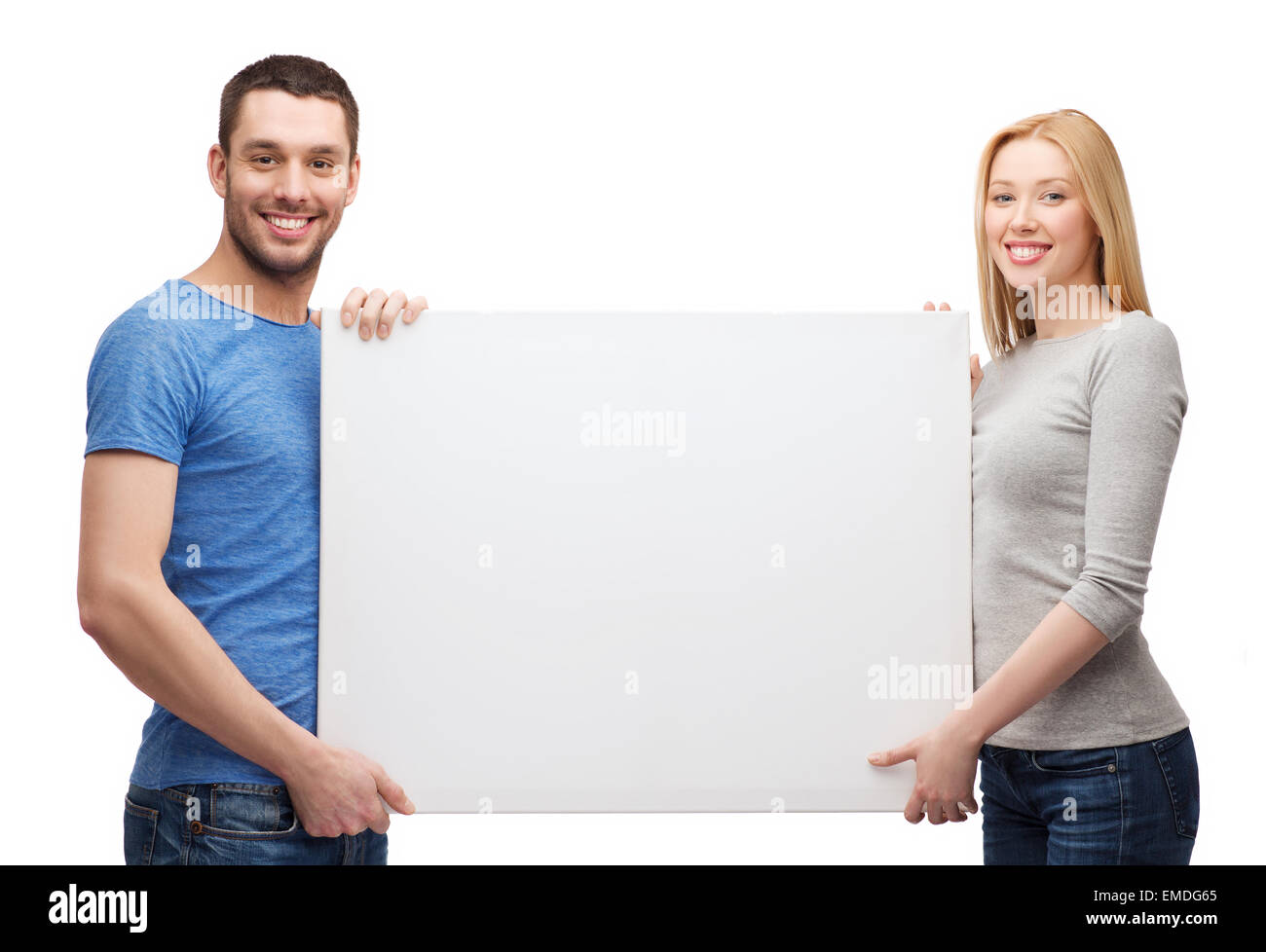 Smiling couple holding blank blanc Banque D'Images