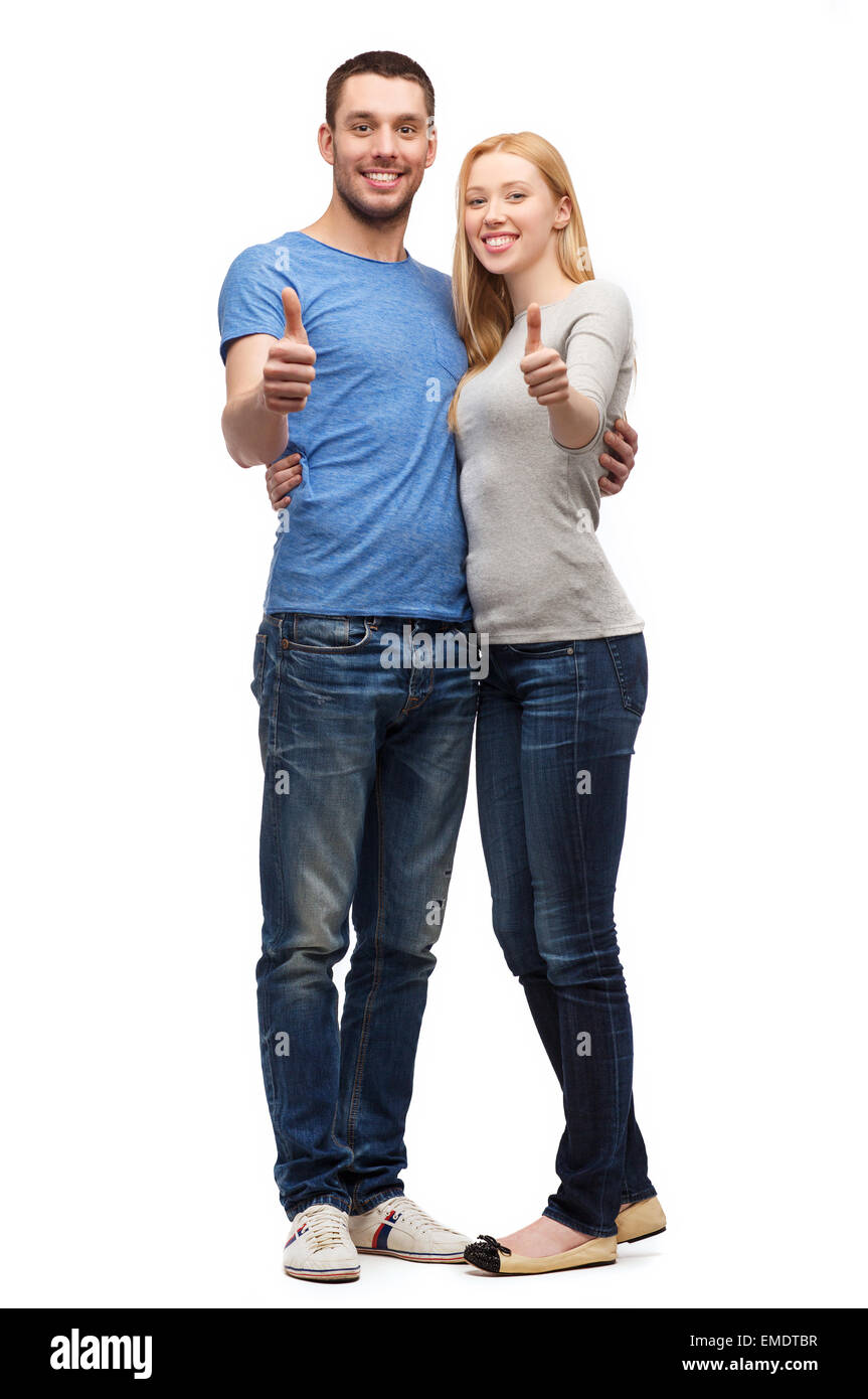 Smiling couple showing Thumbs up Banque D'Images
