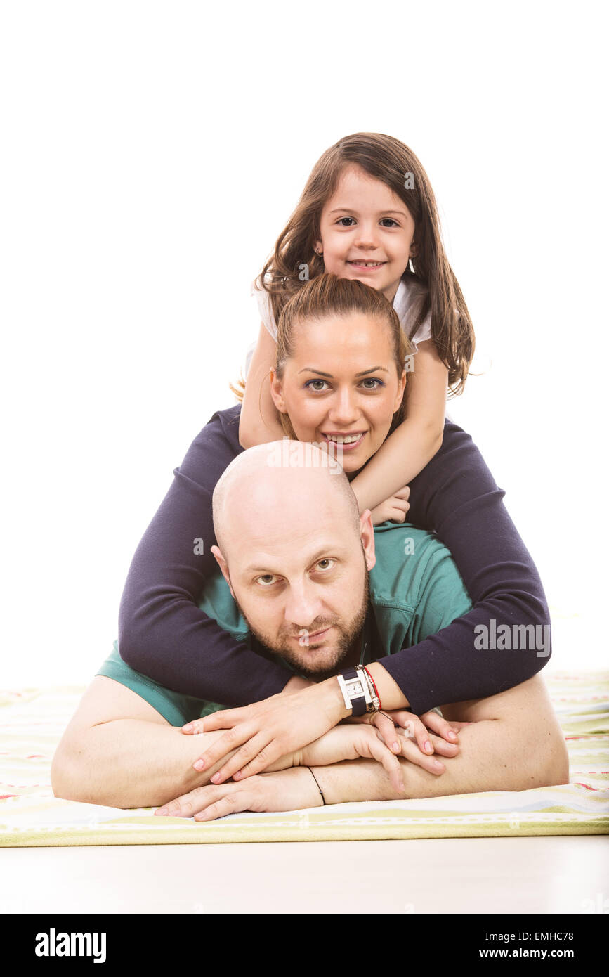 Happy Family standing on top les uns les autres contre fond blanc Banque D'Images