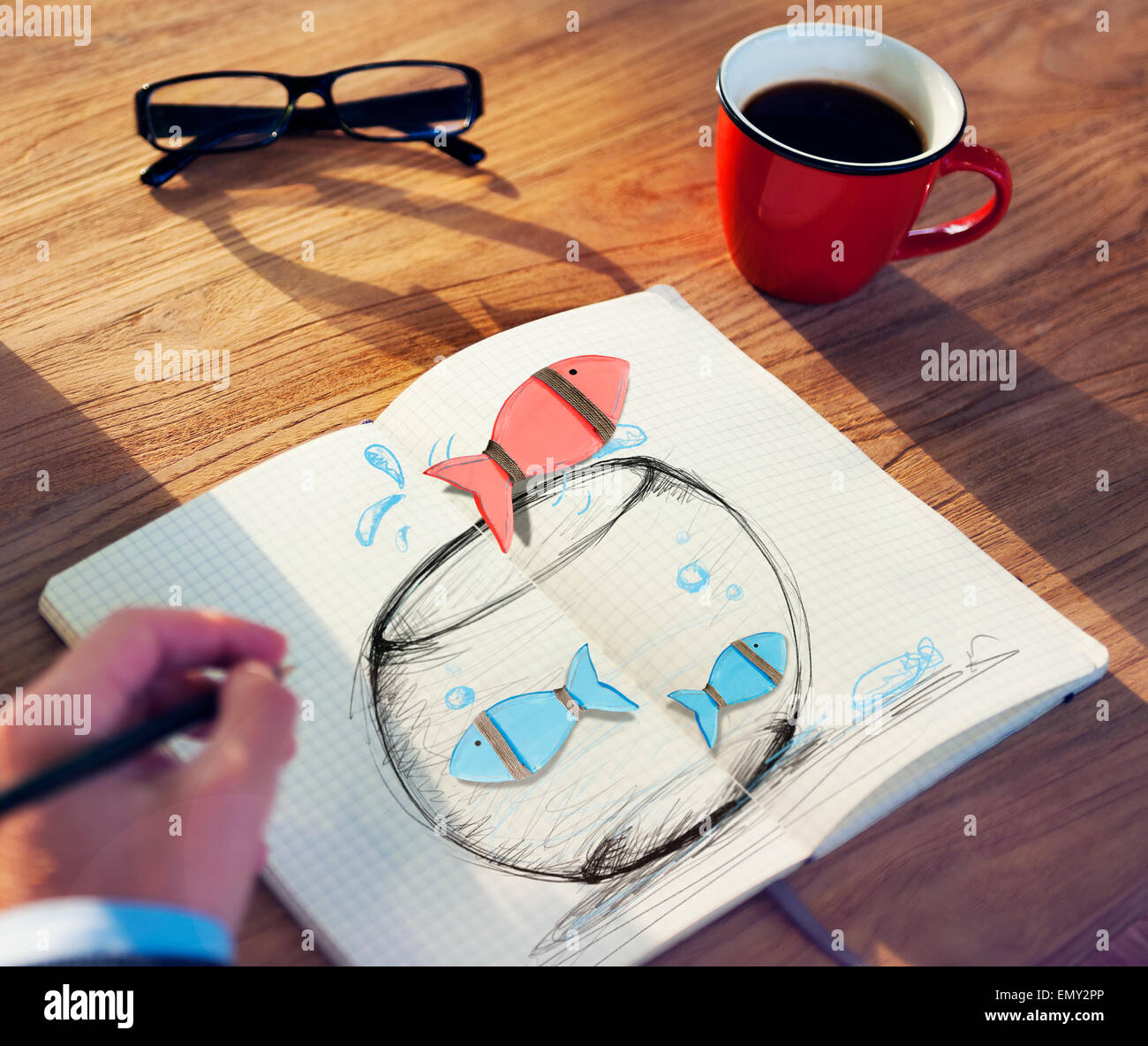 L'homme Poissons Dessin sur un bocal à poissons Banque D'Images