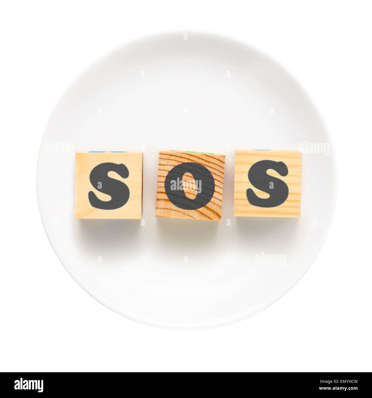 Plaque blanche avec SOS signe composé de blocs de bois. Bad food co Banque D'Images