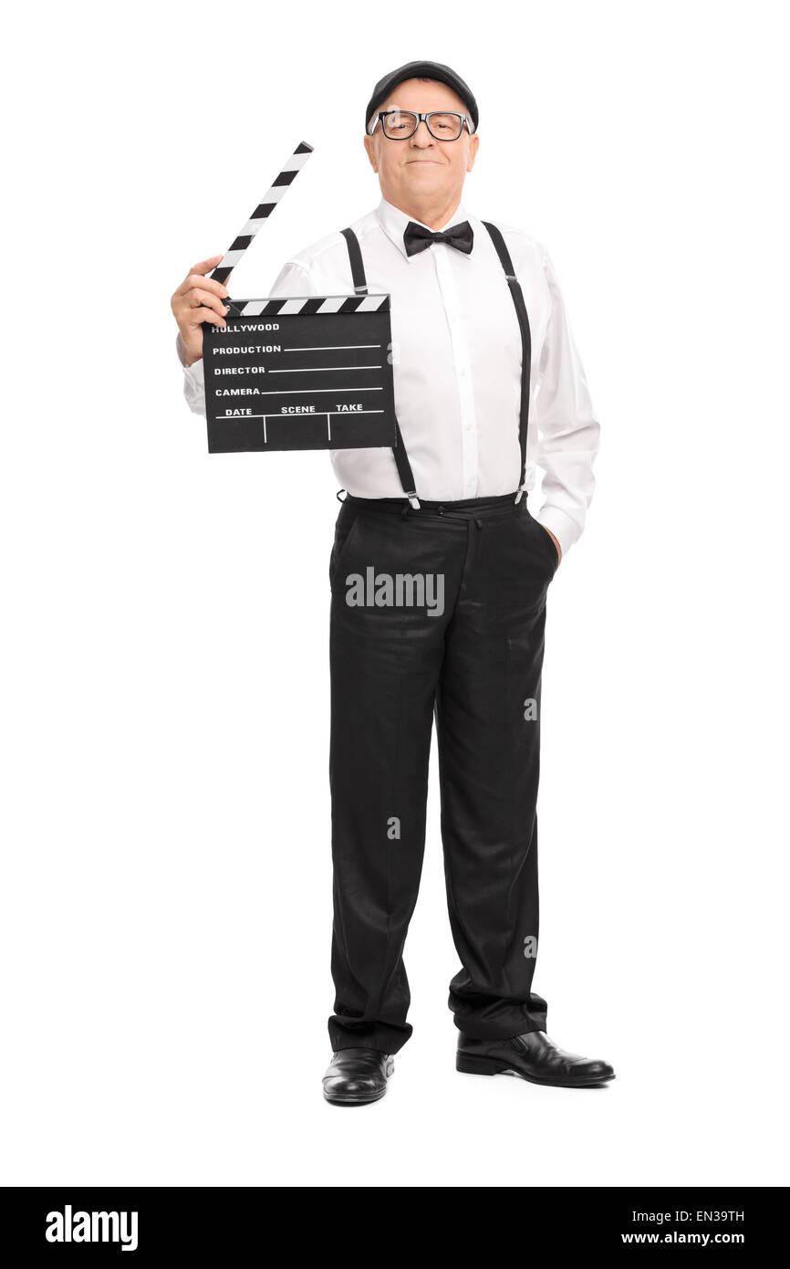 Portrait d'un certain directeur de film mature tenant un clap et regardant la caméra Banque D'Images